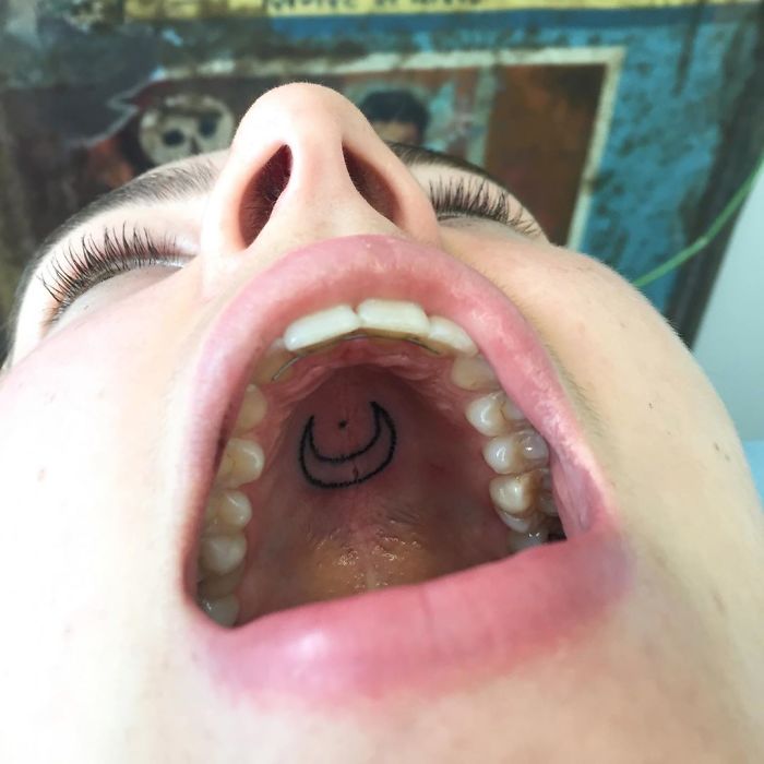 Tattoo on the roof of a mouth, showcasing unconventional body part canvas used by a tattoo artist.