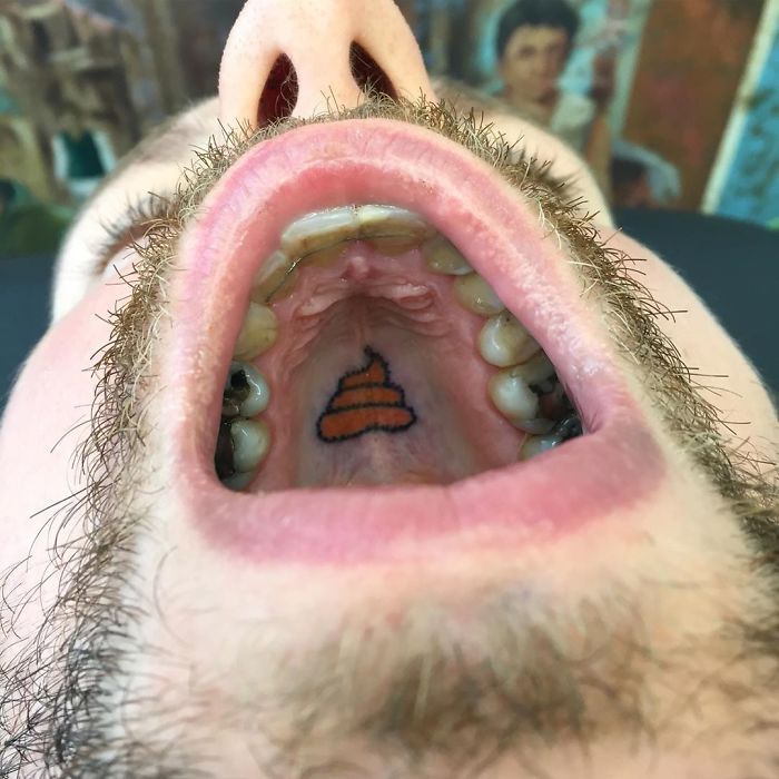 Tattoo on the roof of the mouth, showcasing an unconventional canvas for tattoo art.