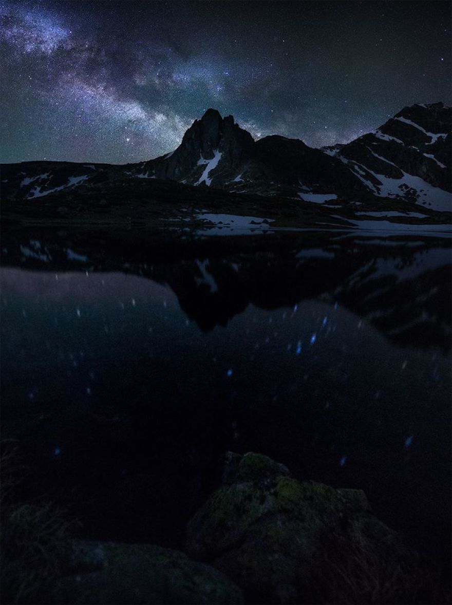 Mountain reflected on a lake at night, when the stars are out