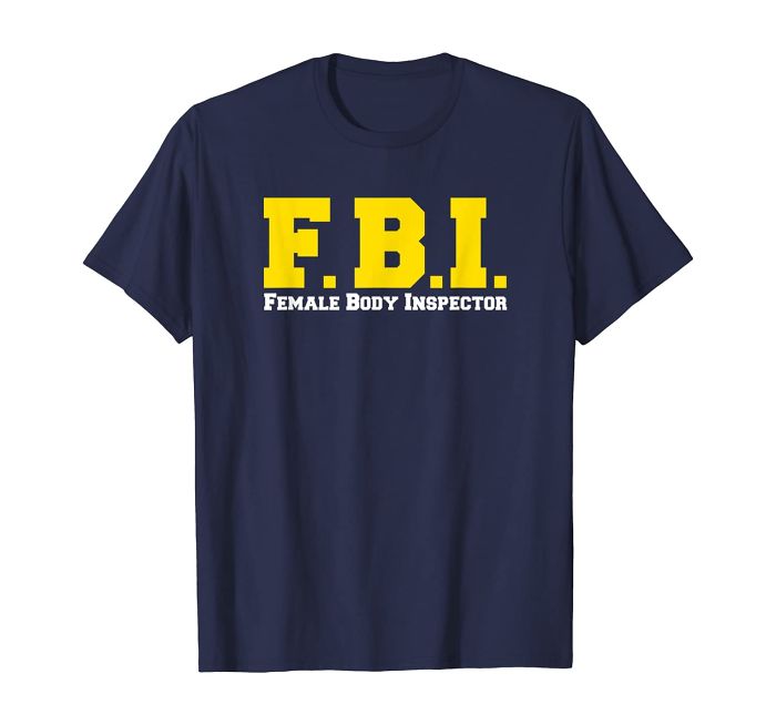 Navy blue t-shirt with bold yellow text spelling FBI and white text Female Body Inspector humor design.