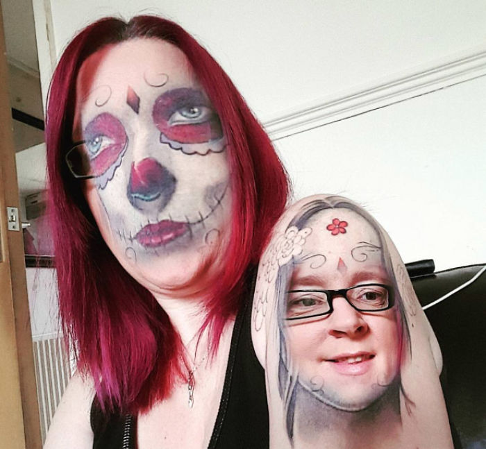 Tattoo face swap on person with colorful face paint and glasses, creating an unsettling visual effect.
