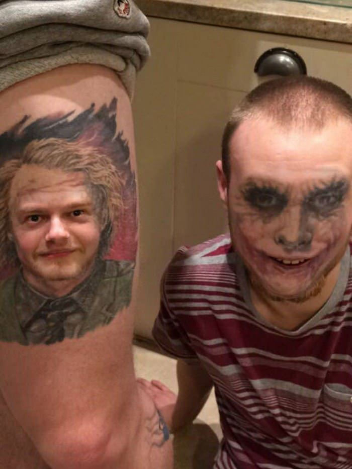 Person with a face-swapped tattoo on their leg.