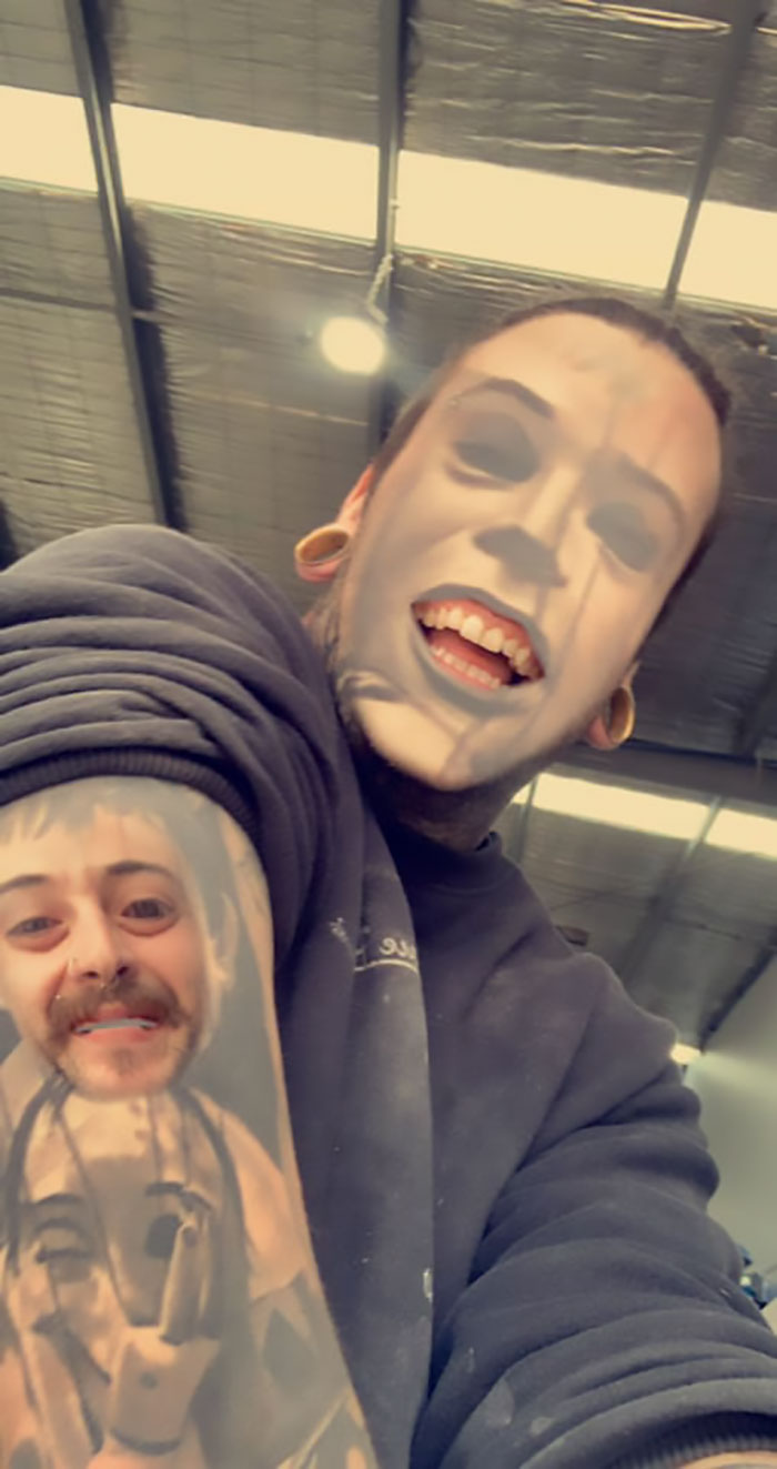Person face swapping tattoos on arm, creating an unsettling visual effect.