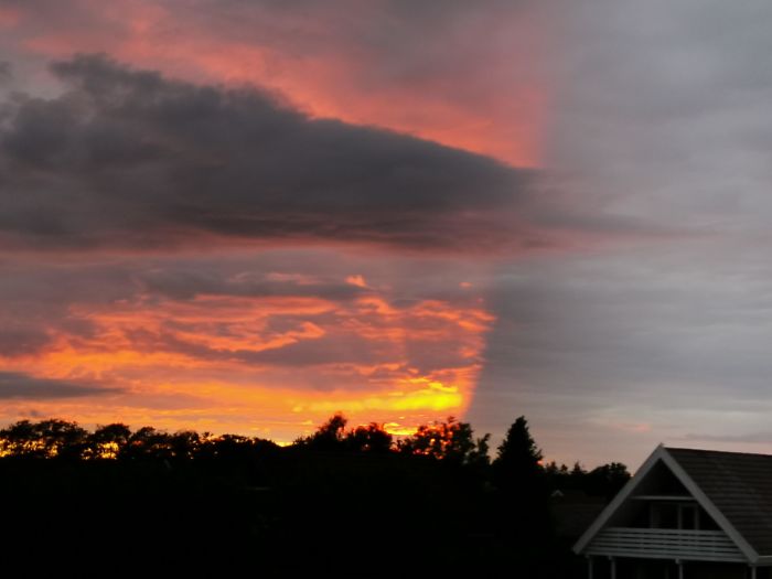 This Strange Clearcut Sundown. Spotted In Denmark, One Minute Past Sundown. What's This Weather Phenomenon Called?