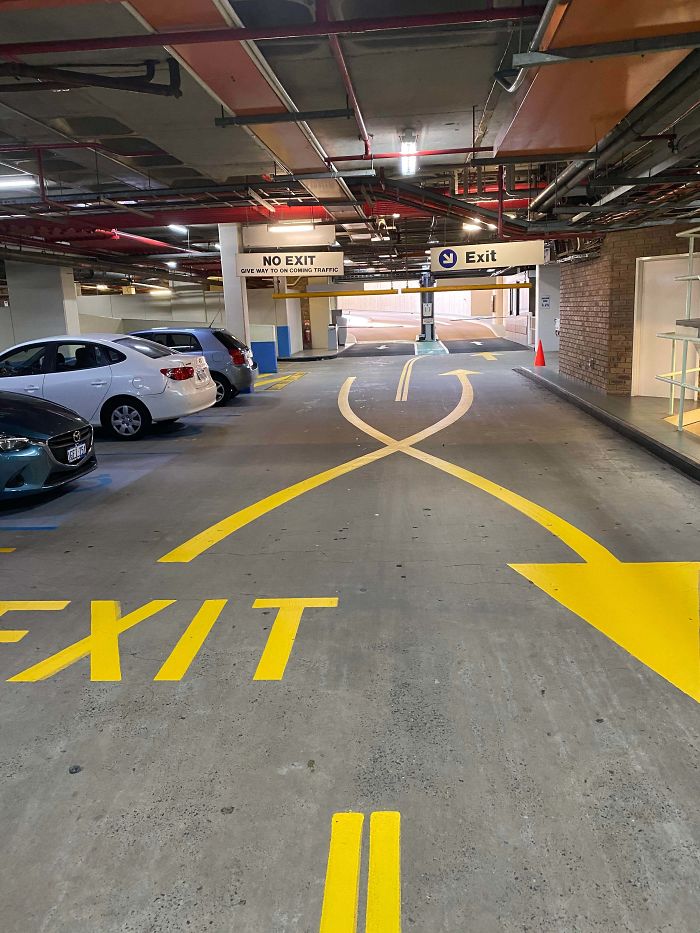 Pulling Into This Car Park Requires You To Keep Right (In A Country That Keeps Left), Then To Resolve It They Do This...