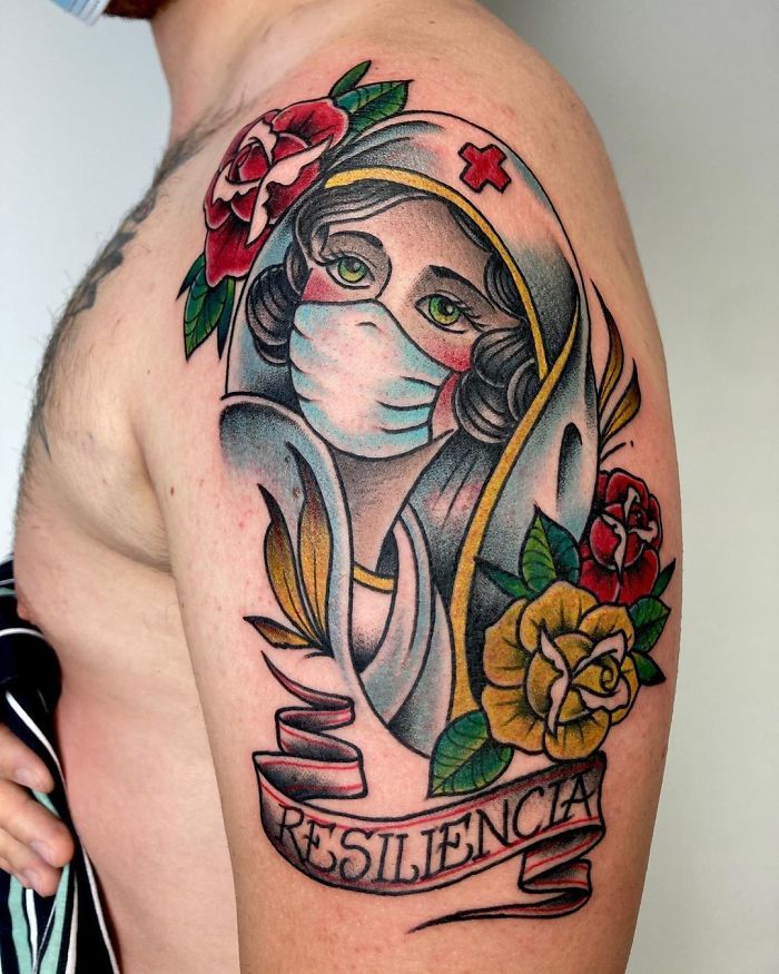 Tattoo of a masked nurse surrounded by roses, highlighting Covid-19 resilience.