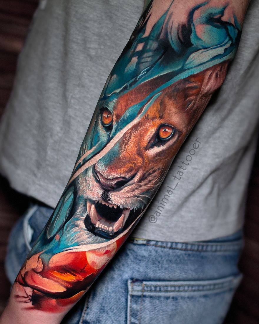 Colorful animal tattoo of a lion on a person's forearm, featuring bright and vivid hues.
