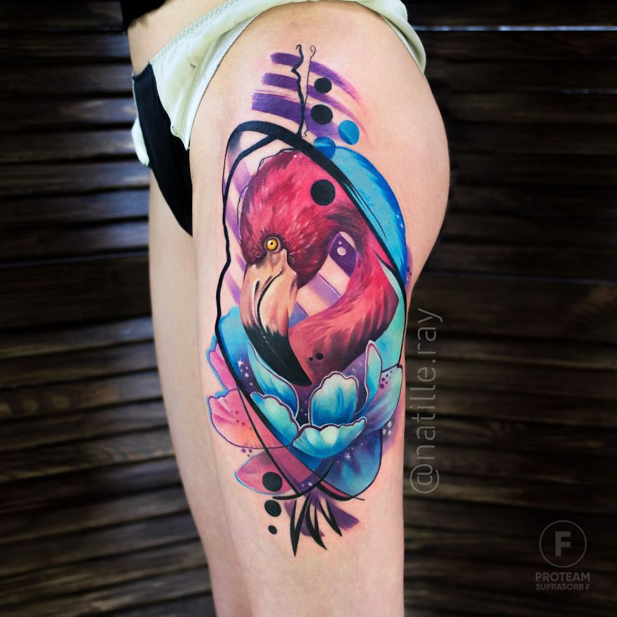 Colorful and bright flamingo tattoo on thigh, featuring dynamic lines and vibrant hues.