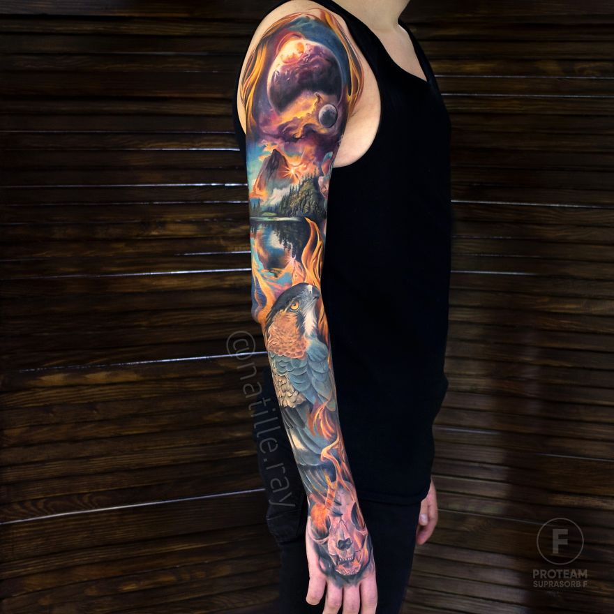 Person showcasing a colorful and bright animal tattoo sleeve on their arm, wearing a black tank top.