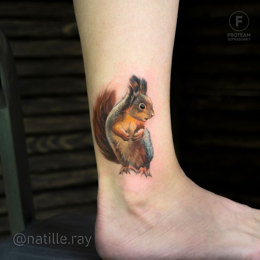 Colorful animal tattoo of a squirrel on a person's ankle, showcasing bright hues and intricate detail.
