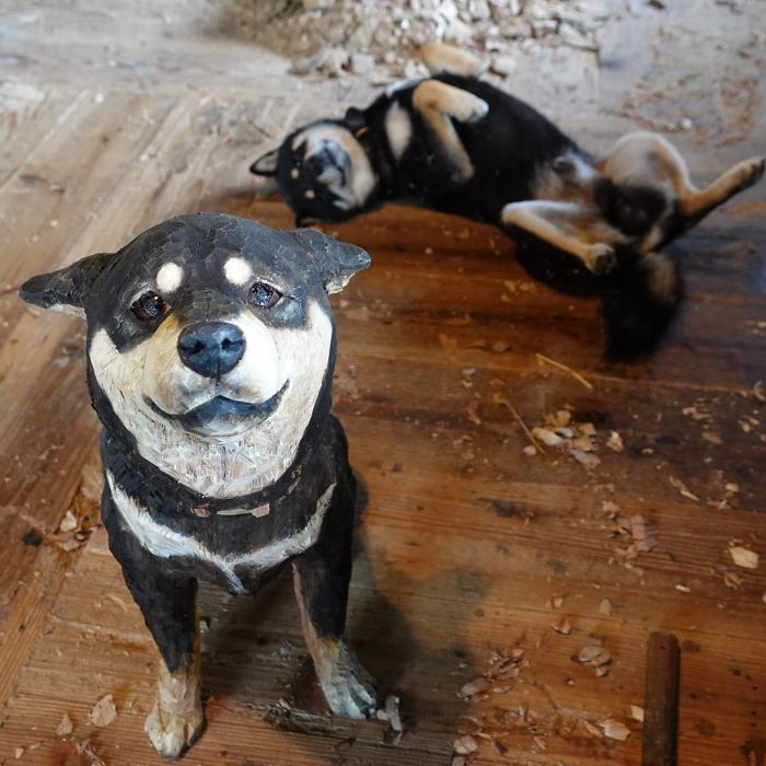 Cute Video Shows Dog Trying To Blend In Between Animal Sculptures