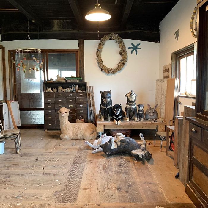 Cute Video Shows Dog Trying To Blend In Between Animal Sculptures