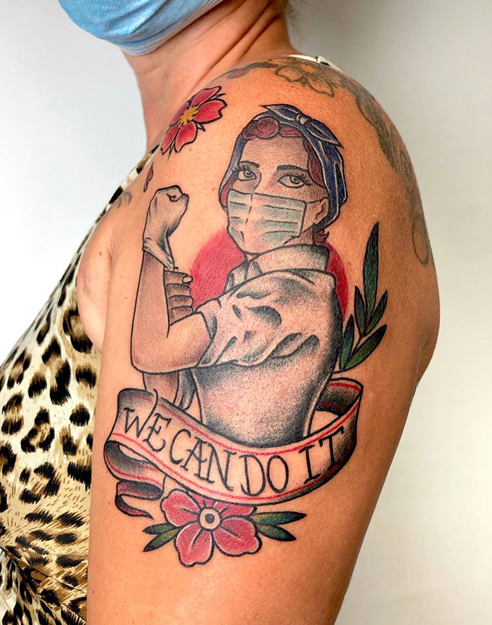 Creative Covid-19 tattoo featuring Rosie the Riveter with a mask, featuring "We Can Do It" text.