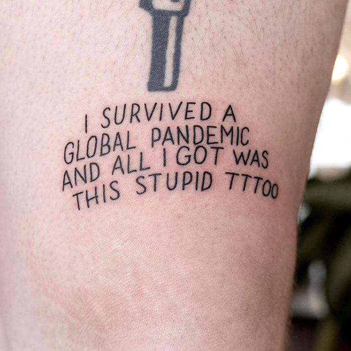 Tattoo reading "I survived a global pandemic and all I got was this stupid tattoo," reflecting Covid-19 creativity.