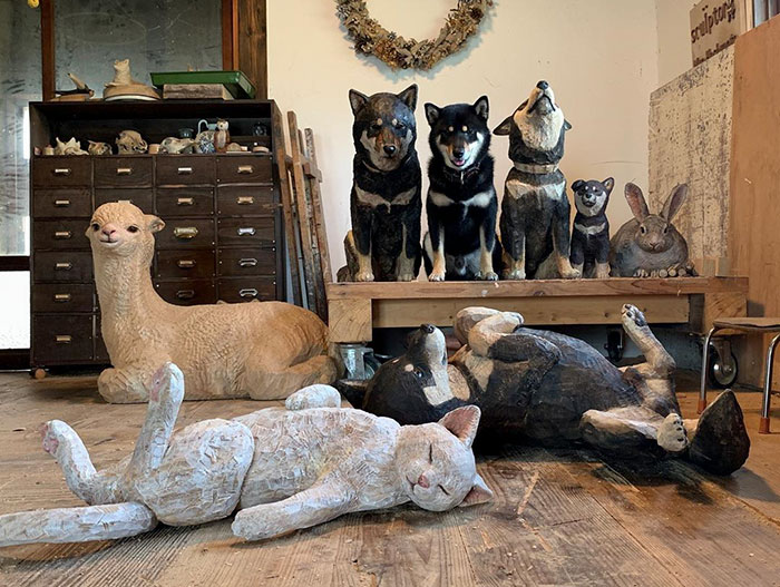 Cute Video Shows Dog Trying To Blend In Between Animal Sculptures
