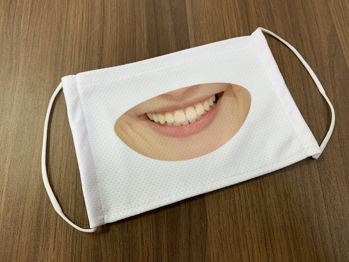 Japanese Shop Launches 'Smile Masks' To Make Customers Think That The Staff Is More Friendly