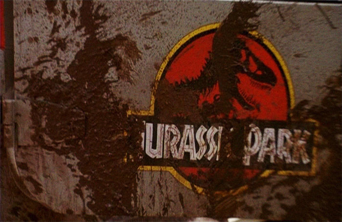 At The End Of Jurassic Park When The Remaining Crew Is About To Get Into The Heilcopter, The JP Logo Is Covered With Mud To Read "Your Ass Park". Condemning The Park In A Hilariously Brilliant Move