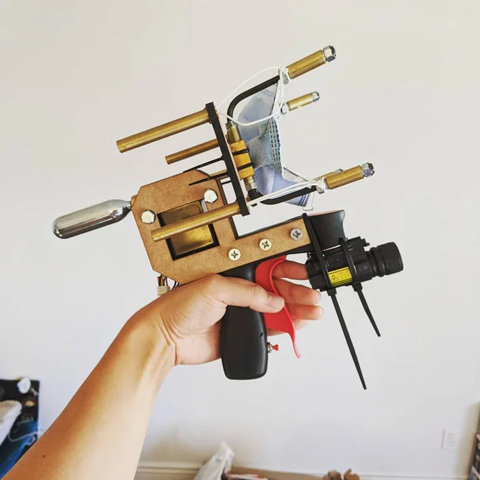 &lsquo;American Solution To An American Problem&rsquo;: Guy Constructs A Gun That Shoots Masks Onto People&rsquo;s Faces