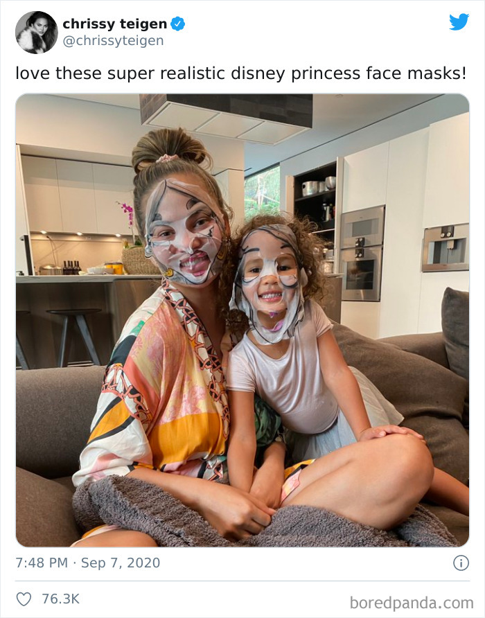Mother and child wearing Disney princess face masks, sharing a cozy moment in a modern kitchen, showcasing parenting tweets.