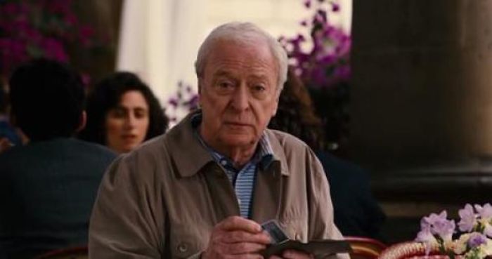 During The Final Scene From The Dark Knight Rises, Alfred Is Seen Tilting His Head Forward Slightly, And Then Tilting His Head Back To Its Original Position. This Is A Nod