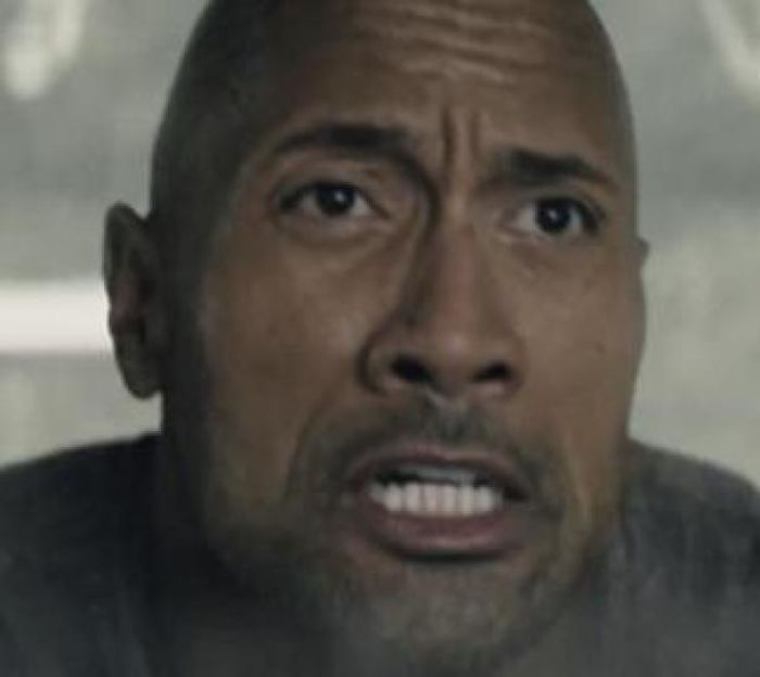 In San Andreas, Dwayne Johnson Survives Using Nothing But His Muscles And Charm. Or Maybe This Is From Skyscraper? Could Be Hobbes & Shaw? Not Really Sure To Be Honest.