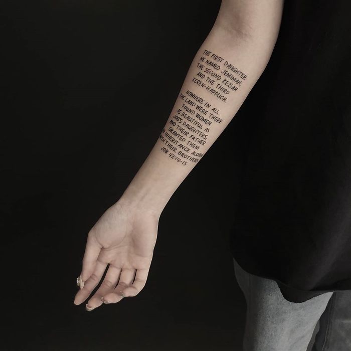 Text tattoo on forearm featuring a quote, showcasing designs artists find overly requested.