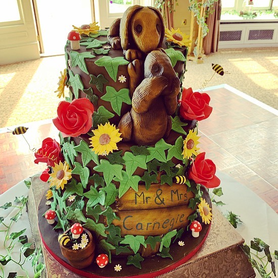 This Secret Garden Inspired Wedding Cake. The Cake Featured Their Beautiful Wedding Flowers Of Red Roses, Daisies, Sunflowers And Ivy