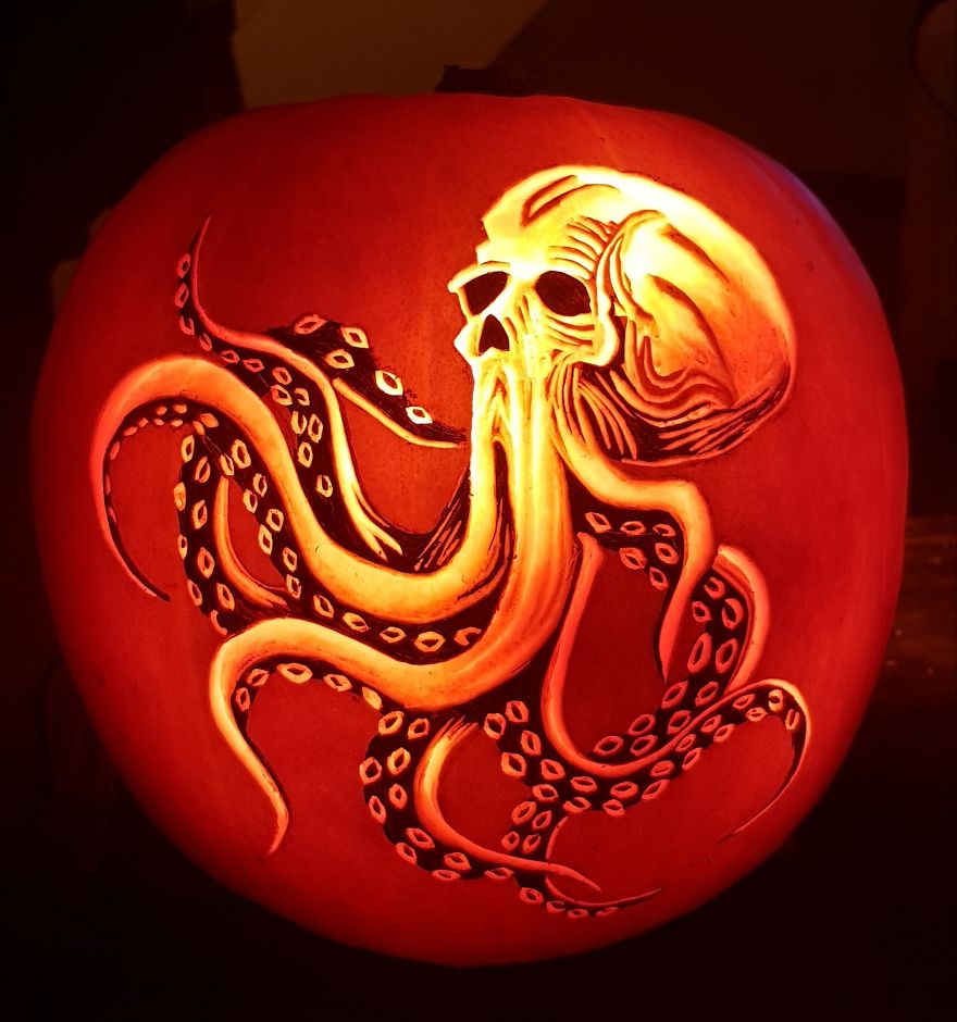 Pumpkin carving depicting a horror scene character with tentacles and a skull-like face.