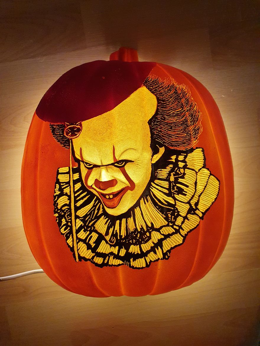 Pumpkin carving of a horror scene character with intricate details and expressive features.