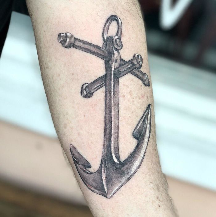 Anchor tattoo design, a common request, inked on a person's forearm.