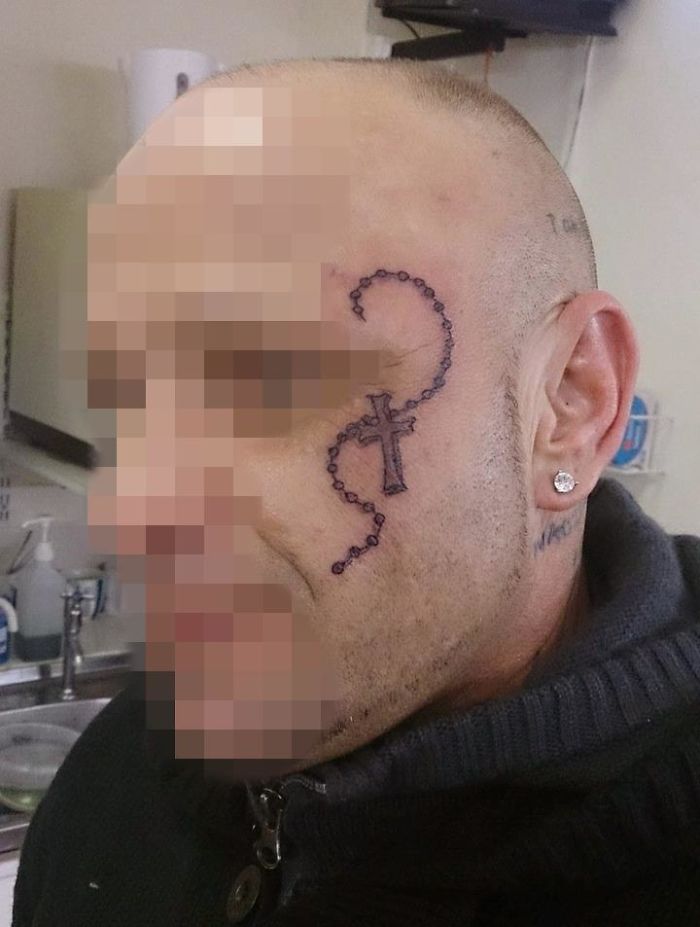 Man with a rosary tattoo on his face, one of the overly requested tattoo designs.