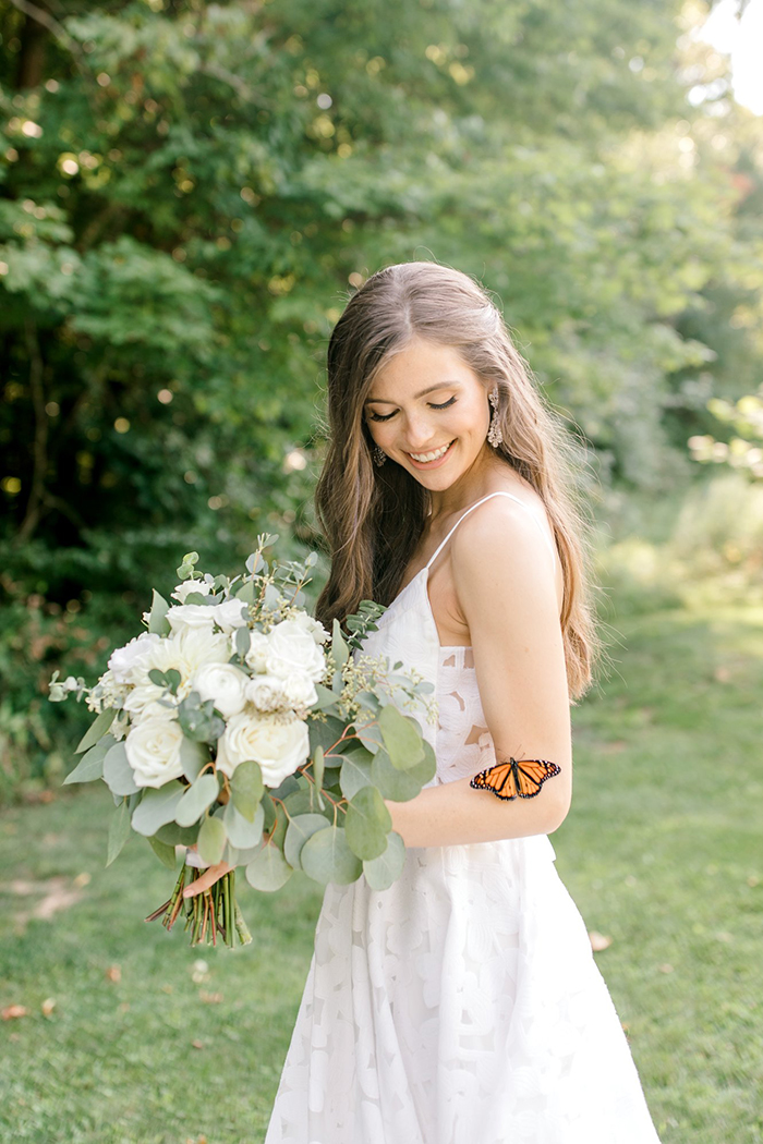Couple's Wedding Photoshoot Gets A Fairytale-Like Twist After A Monarch Butterfly Joins In