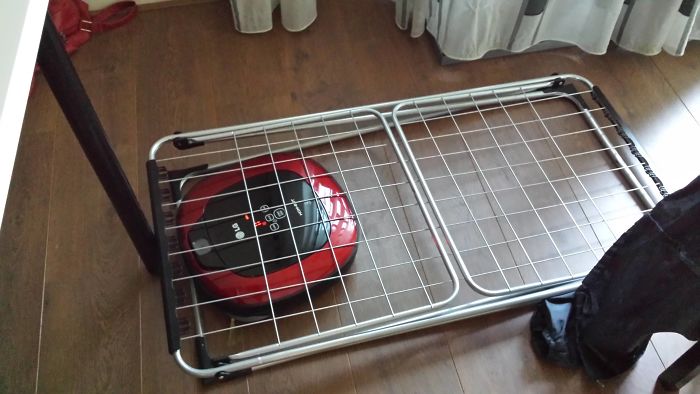 Our Vacuum Cleaning Robot Got Stuck Under The Drying Rack