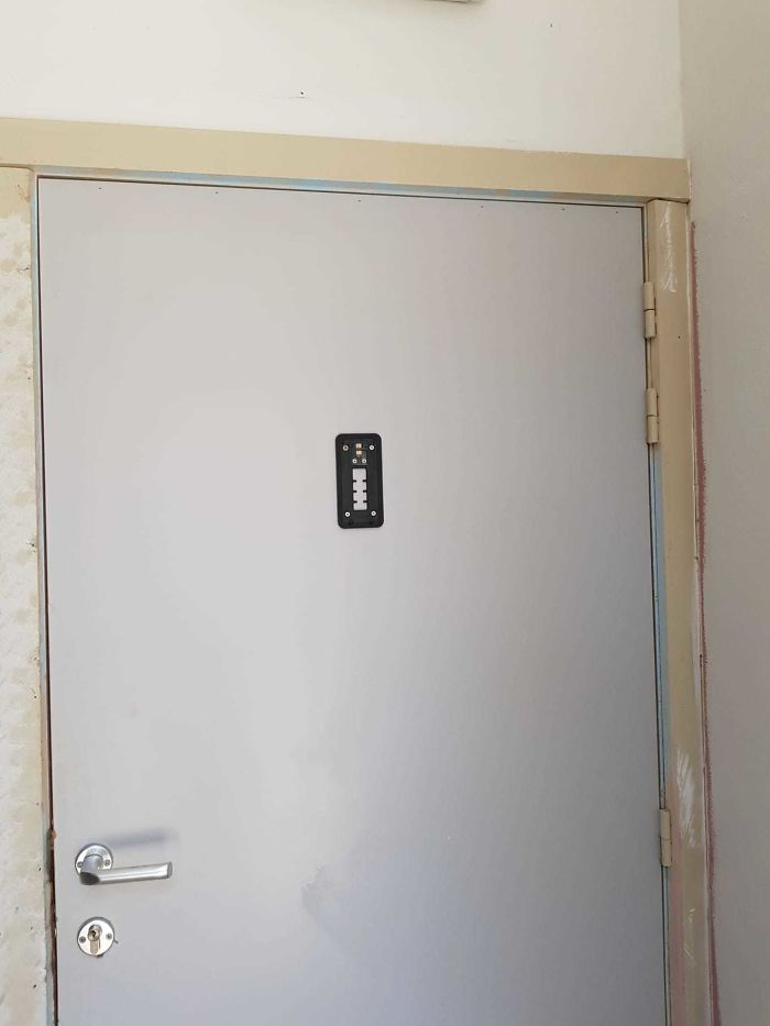 Black Square Thing On The Door With White In The Middle And What Seems To Be Data Chips On The Top On The Door? Dont Recall This Being There Yesterday. Any Ideas?