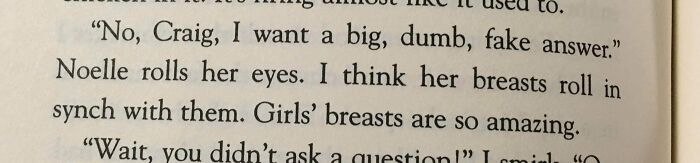 Book page with a paragraph describing woman breast 