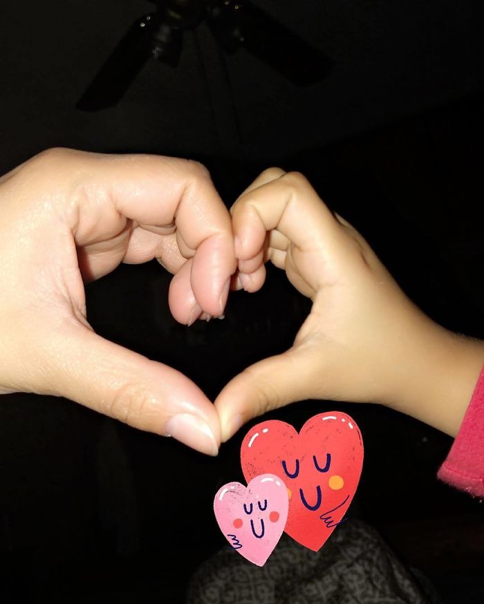 Adult and child hands forming a heart shape, symbolizing love and connection in parenting advice for children.