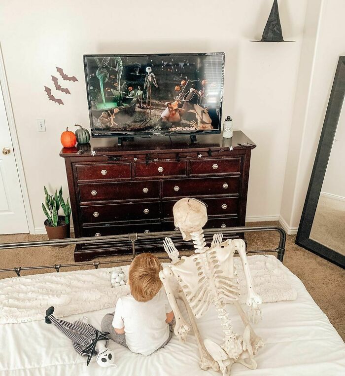 Toddler Befriends A Creepy Skeleton His Parents Got As A Halloween Decoration, Even Has It Watch Over Him As He Sleeps