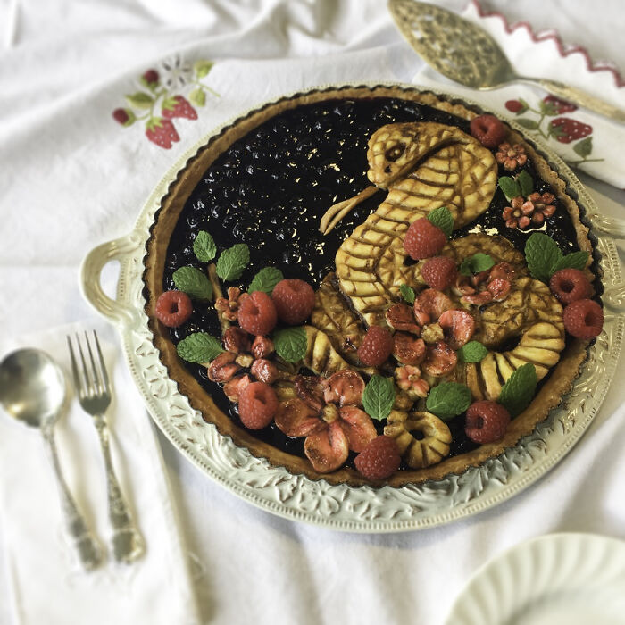 Blueberry Pie With Strawberry Flowers And Raspberries