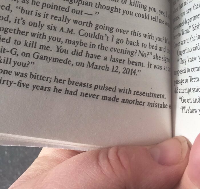 Book page with a paragraph describing woman breast 