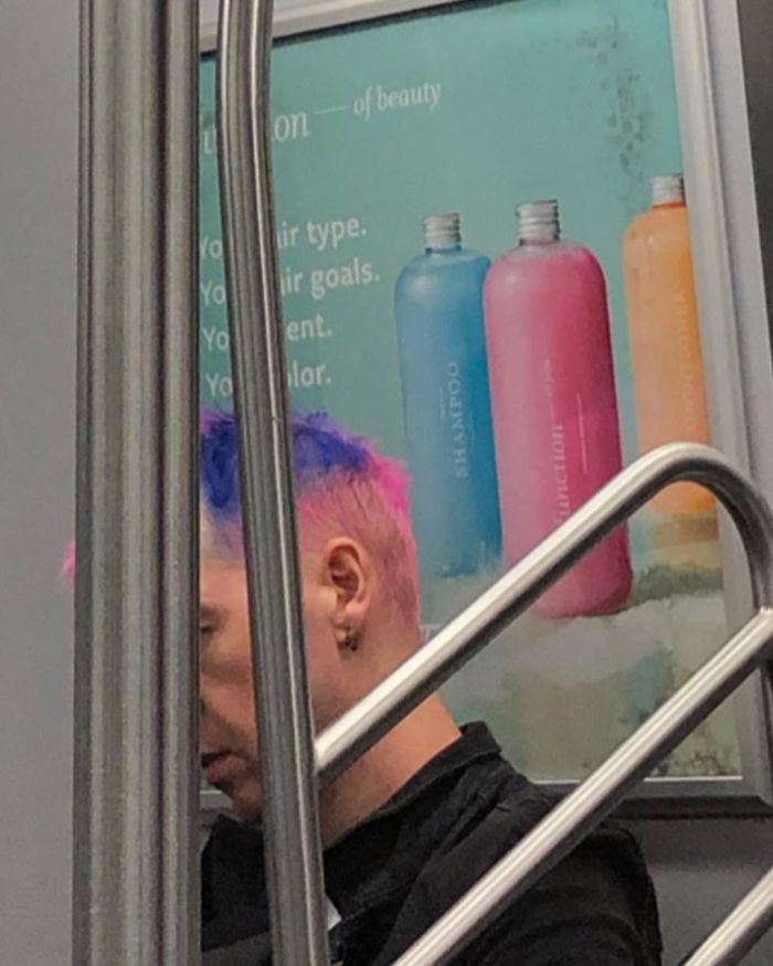 People Sitting Under Signs That Resemble Them