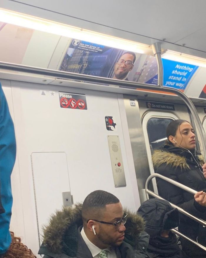 People Sitting Under Signs That Resemble Them