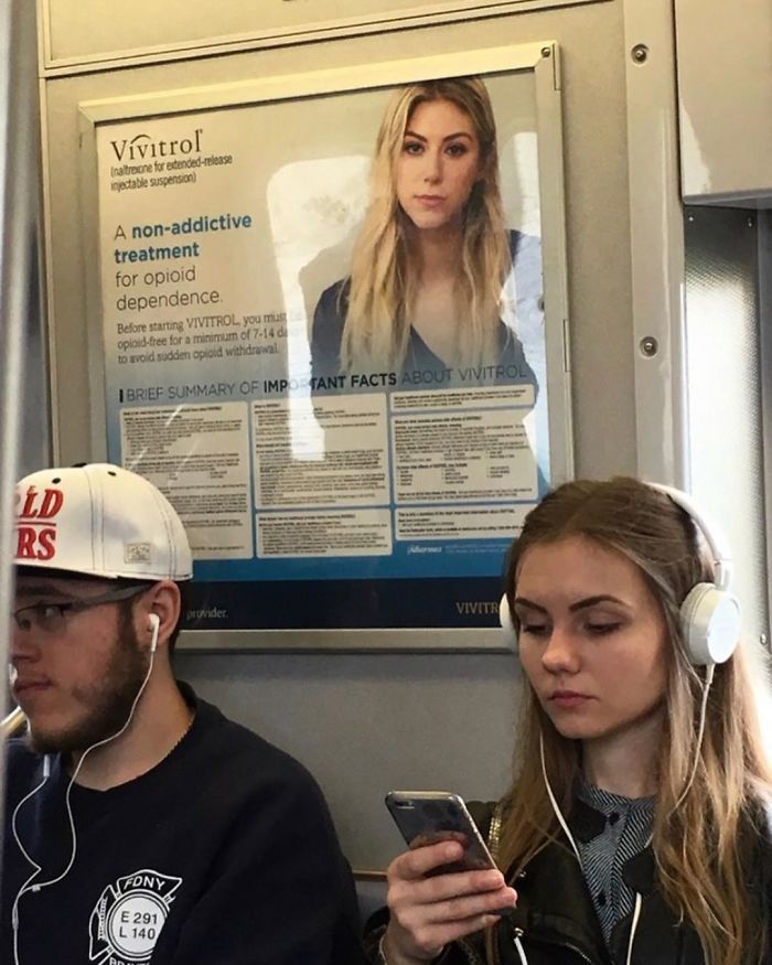 People Sitting Under Signs That Resemble Them
