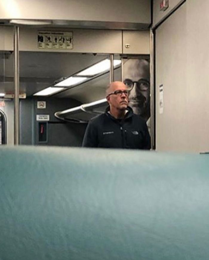 People Sitting Under Signs That Resemble Them