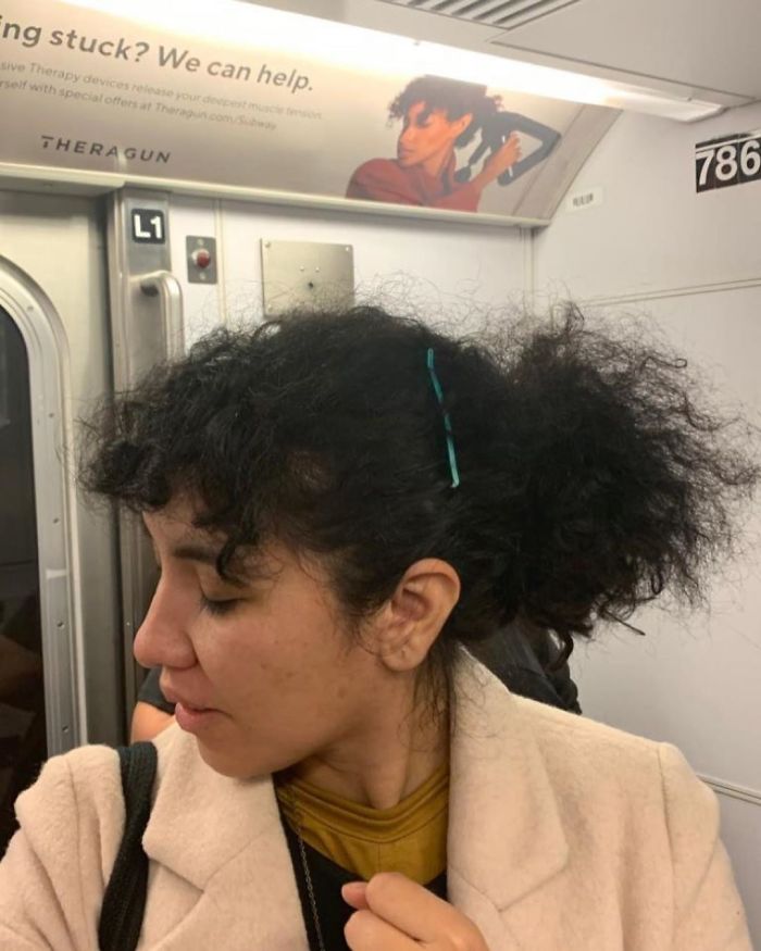 People Sitting Under Signs That Resemble Them