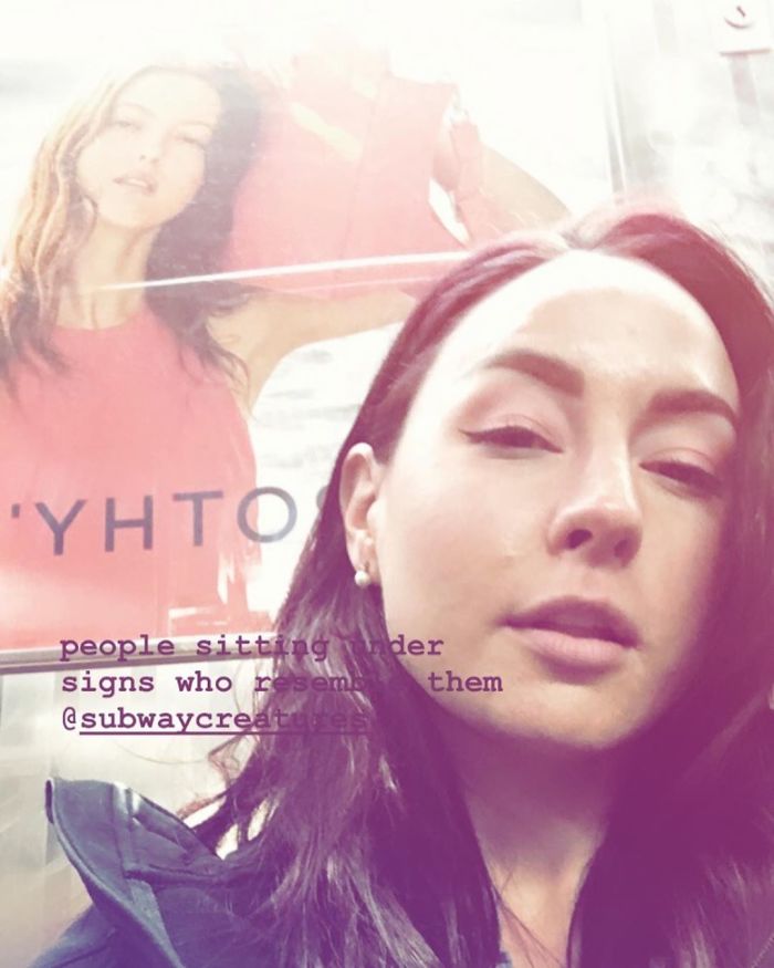 People Sitting Under Signs That Resemble Them