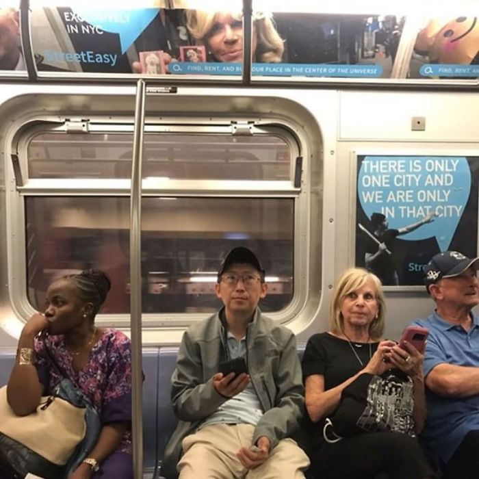 People Sitting Under Signs That Resemble Them