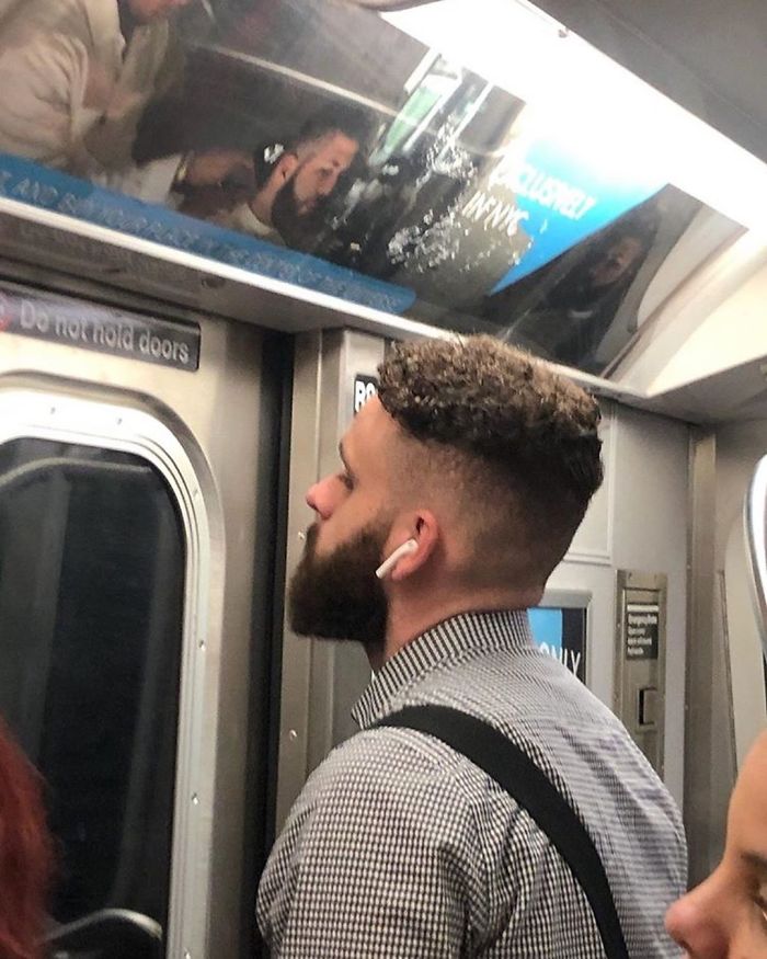 People Sitting Under Signs That Resemble Them