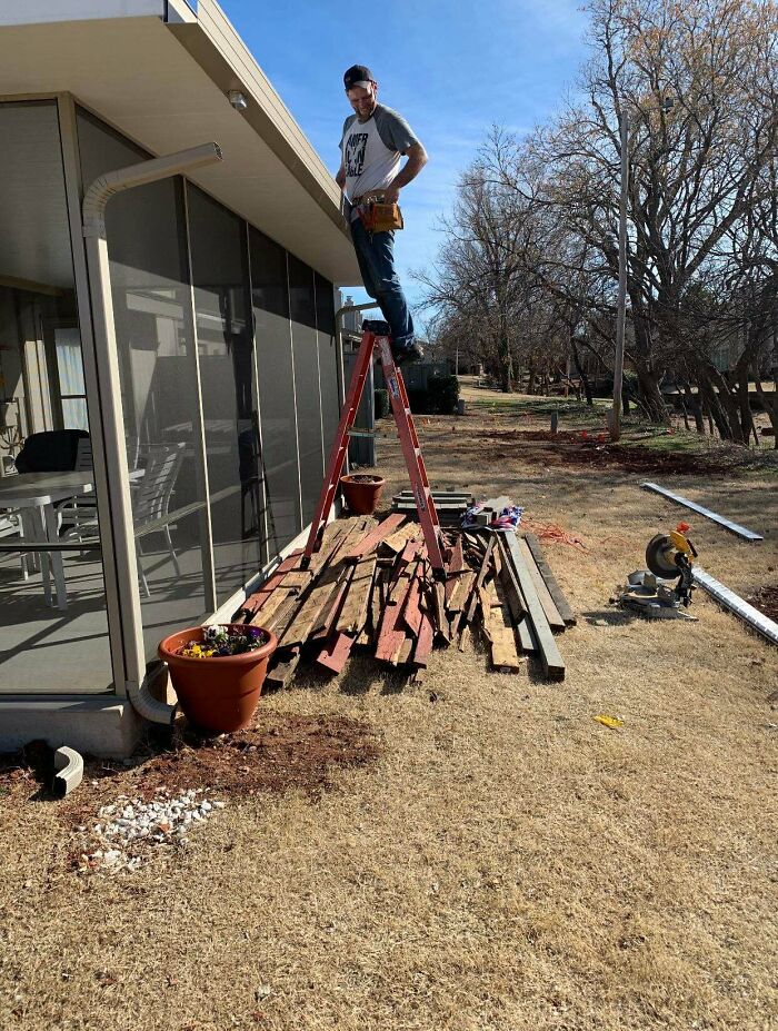 Our Family Hired A Carpenter To Replace The Top Deck. Came Outside To Find Him Balanced Over A Bed Of Rusty Nails