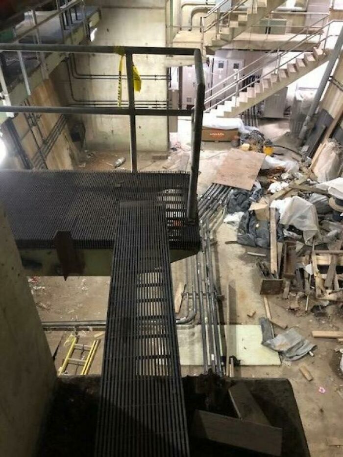 9 Inch Width Of Unsecured Grating Over A 25 Foot Pit. Been This Way For Years