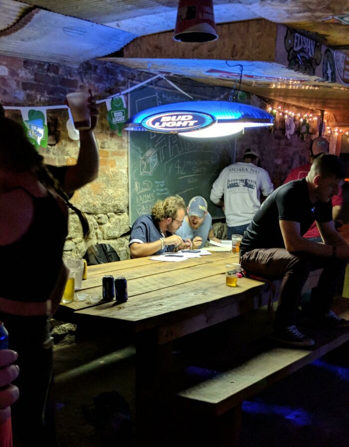 These Guys Doing Homework At The Bar